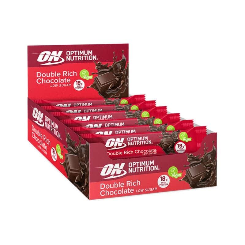 Barra de Proteína Vegan Duplo Chocolate 12 x 60gr Optimum Nutrition, snack proteico vegetal com 18g de proteína e baixo teor de açúcar.
