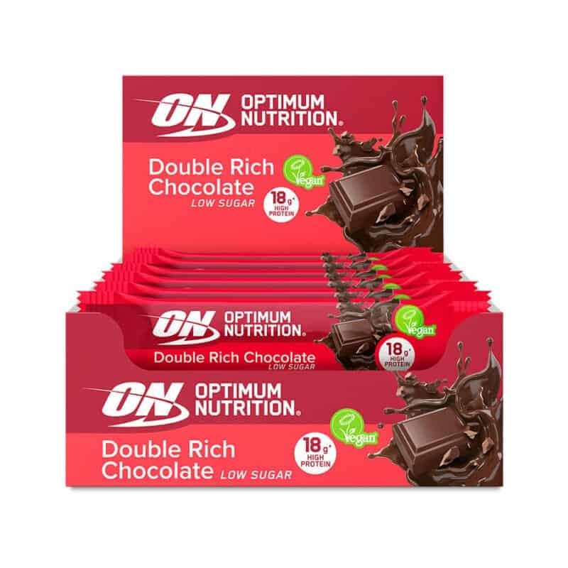 Barra de Proteína Vegan Duplo Chocolate 12 x 60gr Optimum Nutrition, snack proteico vegetal com 18g de proteína e baixo teor de açúcar.
