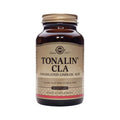 Frasco de vidro âmbar com tampa dourada e rótulo bege, identificado como "Tonalin CLA" da marca Solgar. No rótulo, estão informações como "Conjugated Linoleic Acid," "Sugar, Salt and Starch Free" e "60 Softgels." O frasco possui um design clássico e elegante, típico dos produtos da Solgar, com destaque para a qualidade premium do suplemento alimentar. Este produto é utilizado para ajudar na redução da gordura corporal e na melhoria da tonificação muscular.